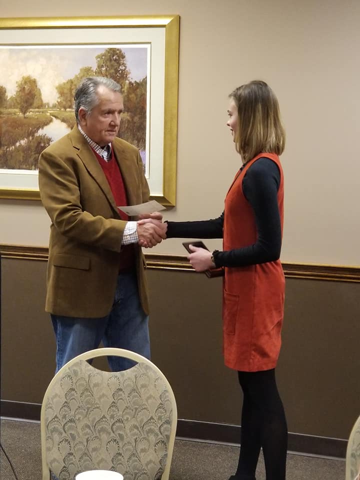 Clare Forbes receiving Western Hills Community Service Club's Student of the Month award.